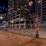 Locks of police violence victims hang on the security fencing around the Hennepin County Government Center.