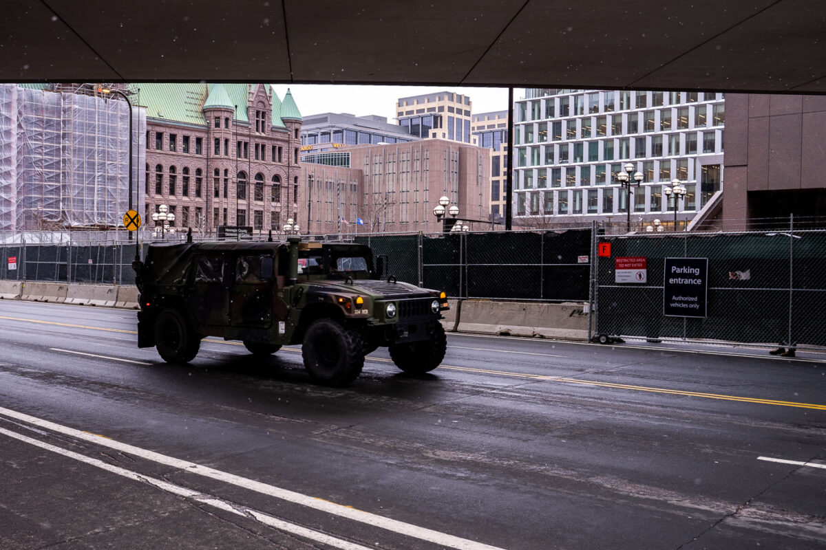 A military vehicle drives around the Hennepin County Government Center. The courthouse is currently holding the Derek Chauvin murder trial. Chauvin is charged in the May 25th murder of George Floyd in South Minneapolis.