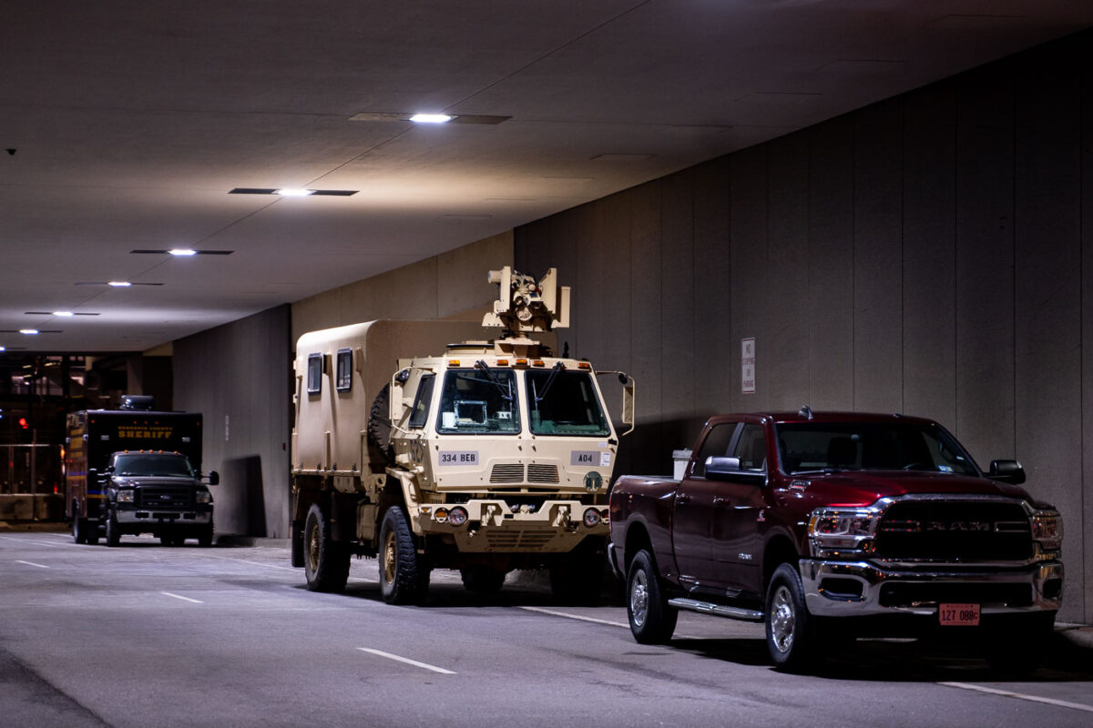 A National Guard vehicle with a optical CROWS system attached sits under the courthouse where Derek Chauvin is standing trial for the death of George Floyd.