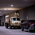 A National Guard vehicle with a optical CROWS system attached sits under the courthouse where Derek Chauvin is standing trial for the death of George Floyd.