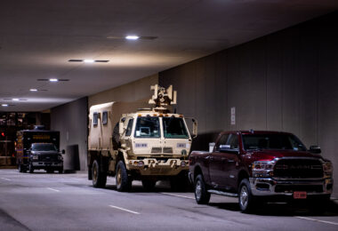 A National Guard vehicle with a optical CROWS system attached sits under the courthouse where Derek Chauvin is standing trial for the death of George Floyd.