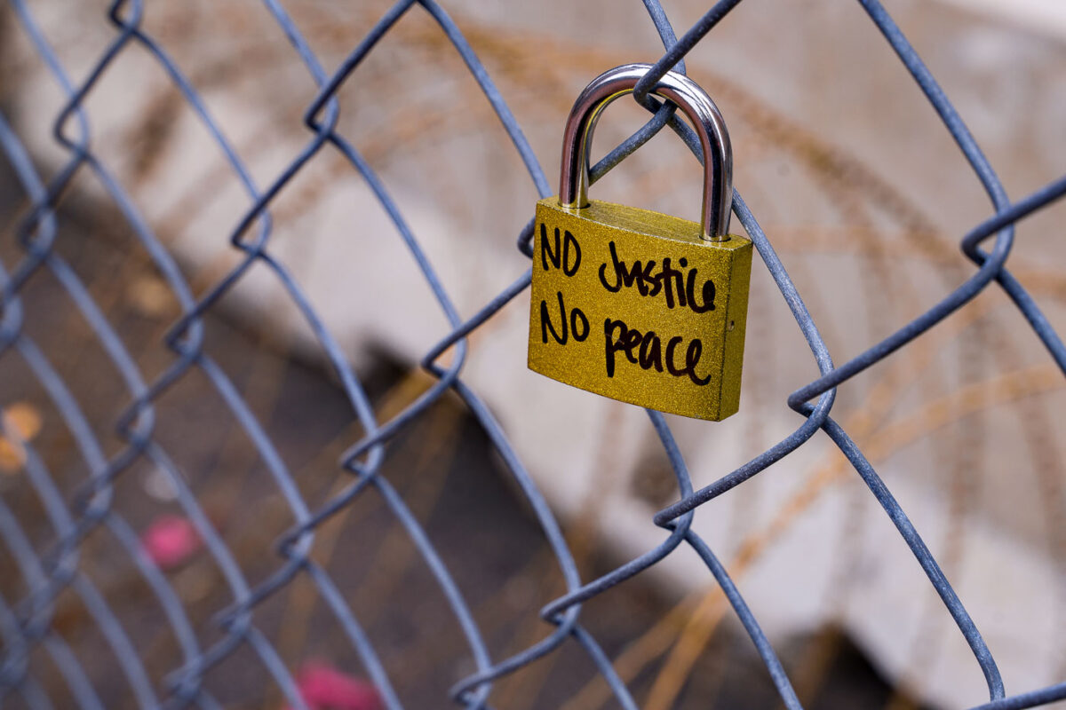 A lock hanging on fencing around the Hennepin County Government Center. The courthouse is currently holding the Derek Chauvin murder trial. Chauvin is charged in the May 25th murder of George Floyd in South Minneapolis.