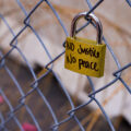 A lock hanging on fencing around the Hennepin County Government Center. The courthouse is currently holding the Derek Chauvin murder trial. Chauvin is charged in the May 25th murder of George Floyd in South Minneapolis.