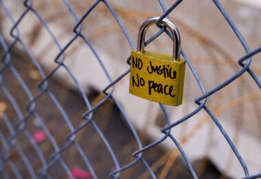 A lock hanging on fencing around the Hennepin County Government Center. The courthouse is currently holding the Derek Chauvin murder trial. Chauvin is charged in the May 25th murder of George Floyd in South Minneapolis.