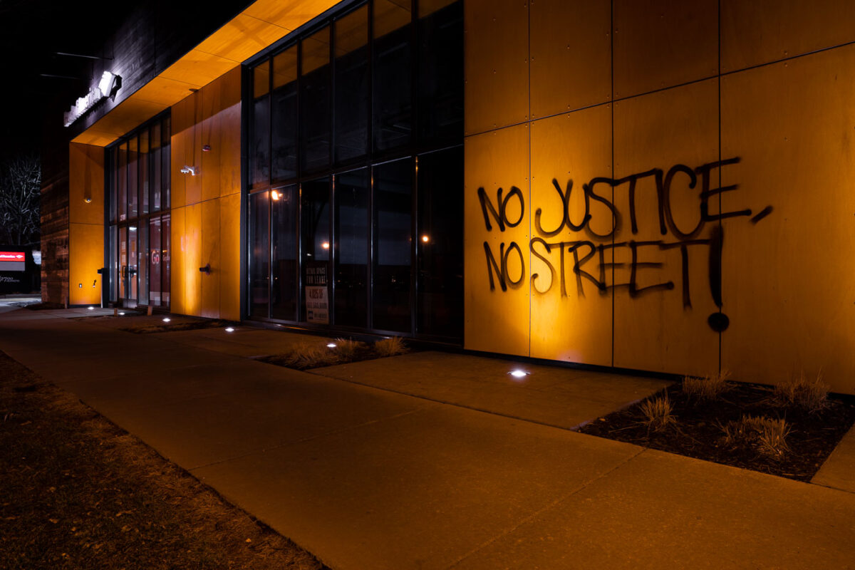 "No Justice, No Strteet!" written on the side of building in Uptown Minneapolis. It refers to George Floyd Square where the city has had press conferences the last 2 days about opening the intersection back up to vehicular traffic. The intersection has been closed since George Floyd's May 25th death and been held by the community as a place of protest and sacred ground.