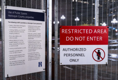 Signage on secure fencing around the government center. The Derek Chauvin trial is set to begin on March 8th.