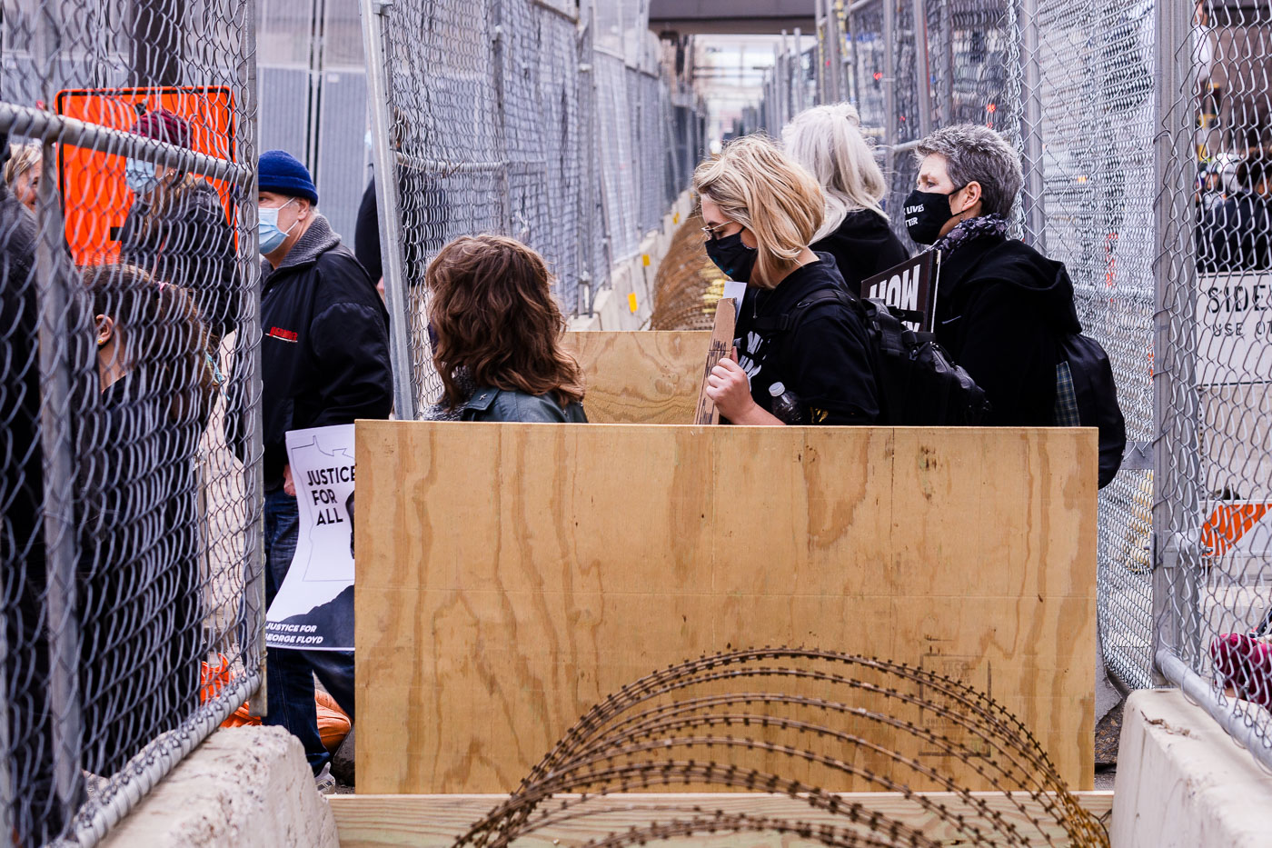 Protesters enter a secured area around Chauvin trial