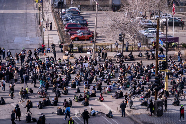 Protesters sit during a march at start of Chauvin trial 1 Protesters march through downtown Minneapolis during the Derek Chauvin murder trial. Chauvin was convicted in the murder of George Floyd.