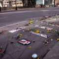 Protesters place mirrors and red paint on the road outside the courthouse.