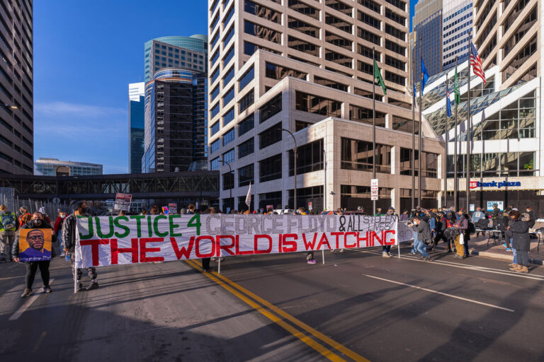 The World Is Watching protest in Minneapolis 4 Protesters gathered outside the Hennepin County Government Center prior to the 8am start of the Derek Chauvin trial. Former Minneapolis Police Officer Derek Chauvin is charged in the murder of George Floyd on May 25th, 2020.