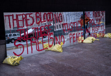 Protest signs in the form of mirrors outside the Hennepin County Government Center. The courthouse is currently holding the Derek Chauvin murder trial. Chauvin is charged in the May 25th murder of George Floyd in South Minneapolis.