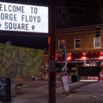 The former Speedway Gas sign reads "Welcome to George Floyd Square".