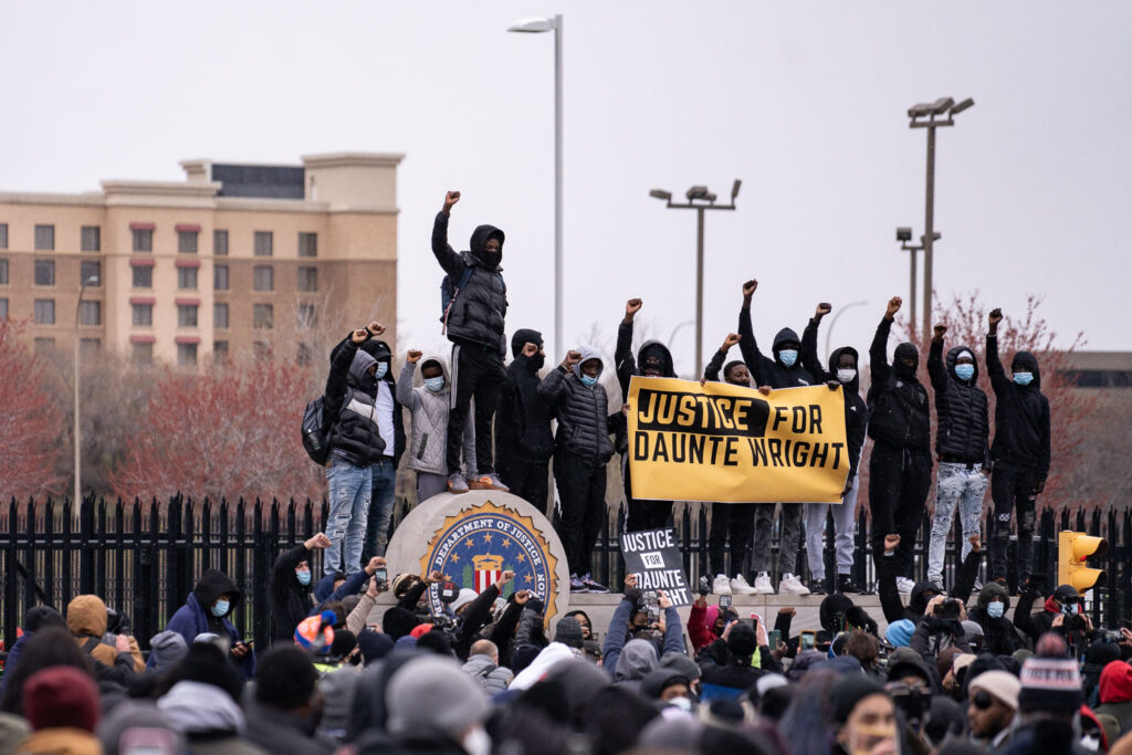 Protesters on top of the FBI Minneapolis Field Office during a march protesting the death of 20-year old Daunte Wright. Wright was shot and killed by Brooklyn Park Police officer Kim Potter during a traffic stop on April 11th.