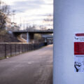 A police abolition sign pasted under a bridge on the Minneapolis Midtown Greenway.