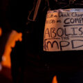 Abolish the MPD protest sign on someones back during a march through downtown Minneapolis.