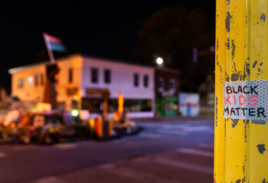 A sticker on a light pole inside George Floyd Square in South Minneapolis.