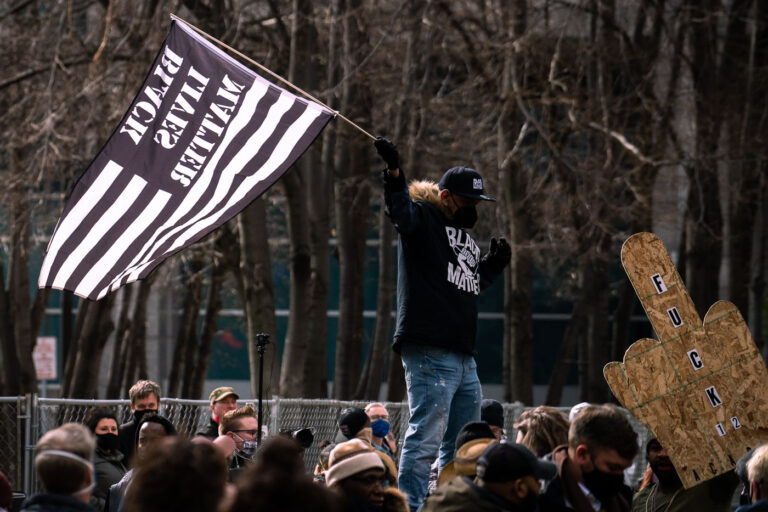 Black Lives Matter flag following Chauvin conviction 1 April 20, 2021 - Minneapolis -- A crowd gathered outside the Hennepin County Government Center celebrate the guilty verdict in the Derek Chauvin murder trial. Chauvin was found guilty on all 3 counts.