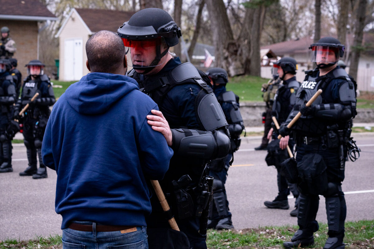 A protester speaks with the Brooklyn Center Police shortly after Daunte Wright was shot and killed by Brooklyn Center Police Officer Kim Potter.