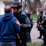 A protester speaks with the Brooklyn Center Police shortly after Daunte Wright was shot and killed by Brooklyn Center Police Officer Kim Potter.