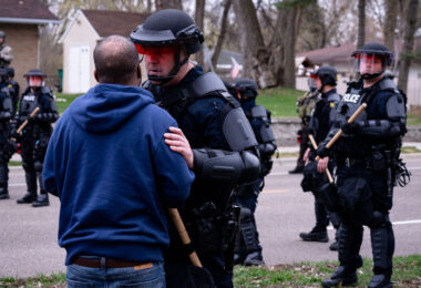 A protester speaks with the Brooklyn Center Police shortly after Daunte Wright was shot and killed by Brooklyn Center Police Officer Kim Potter.