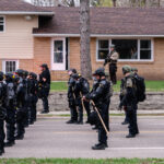 Police arrive at the scene of the Daunte Wright death as protesters gather.