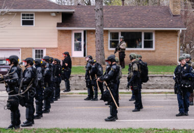 Police arrive at the scene of the Daunte Wright death as protesters gather.