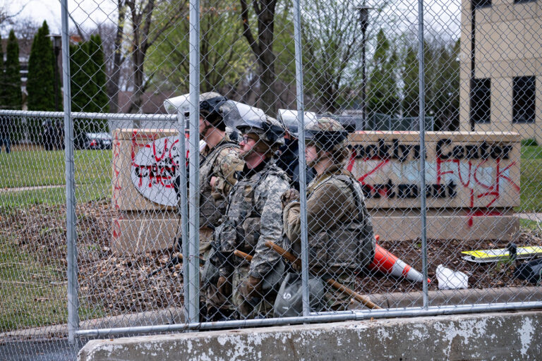 Brooklyn Center police guard the police station 4 Police Officers stand guard outside the Brooklyn Center Police Department the evening after Daunte Wright was killed by Officer Kim Potter.