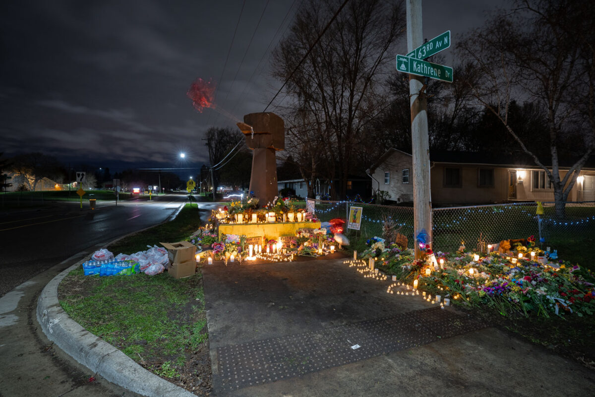 A memorial for Daunte Wright stands where he died. The wooden fist sculpture was the original fist from George Floyd Square.