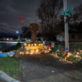 A memorial for Daunte Wright stands where he died. The wooden fist sculpture was the original fist from George Floyd Square.