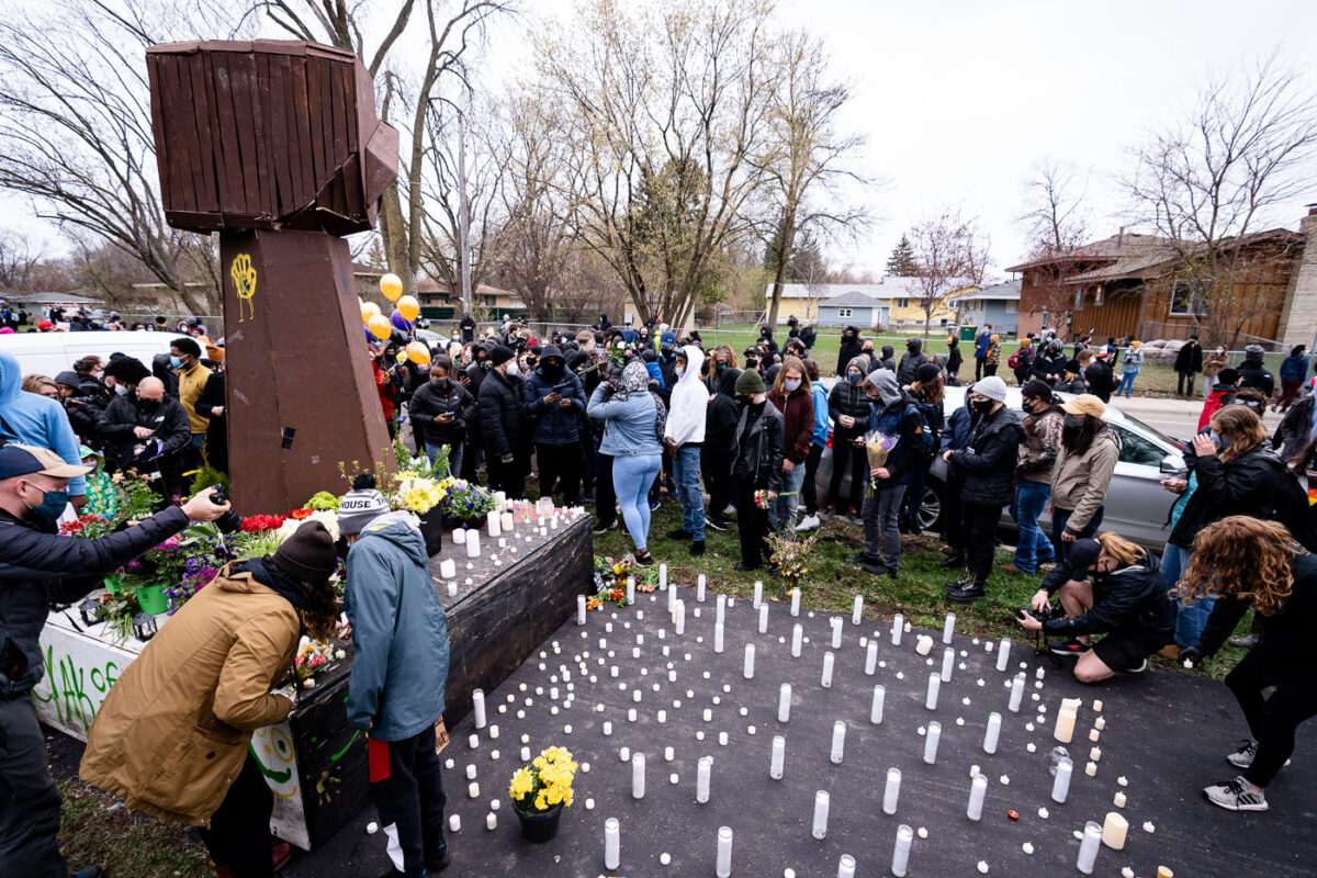 People gather at the site of Daunte Wrights death in Brooklyn Center.