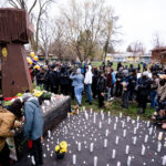 People gather at the site of Daunte Wrights death in Brooklyn Center.