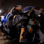 Daunte Wright protesters with Umbrellas in Brooklyn Center 2 Protesters use umbrellas to shield themselves from chemical irritants being used by police outside the Brooklyn Center Police Department. Protesters are protesting the shooting death of 20-year old Daunte Wright on April 11th, 2021.