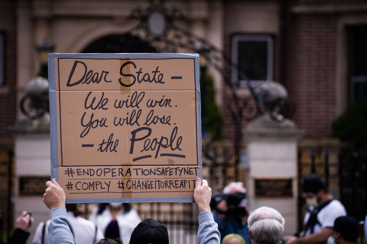 Protesters gather outside the Minnesota Governor's Residence to protest the treatment of protesters over the last week.