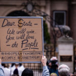 Protesters gather outside the Minnesota Governor's Residence to protest the treatment of protesters over the last week.