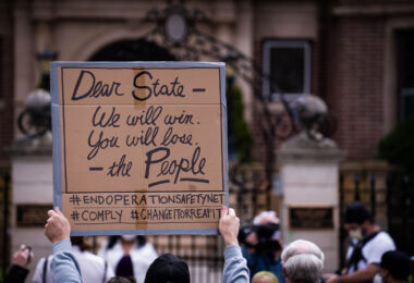 Protesters gather outside the Minnesota Governor's Residence to protest the treatment of protesters over the last week.