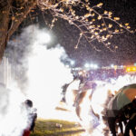 Flashbangs explode in front of Daunte Wright protesters 1 Brooklyn Center Police, Hennepin County Sheriffs, Minnesota State Patrol and the National Guard surround the police station as the community gathers to protest the death of 20-year old Daunte Wright. Wright was shot and killed by Brooklyn Center Police officer Kim Potter during a traffic stop on April 11th.