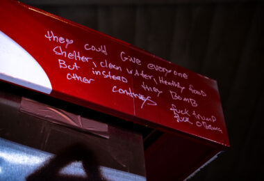 Written on the former gas pumps at the Speedway gas station at George Floyd Square: "they could give every one shelter, clean water, healthy food, but instead they bomb other countries. fuck trump fuck obama"