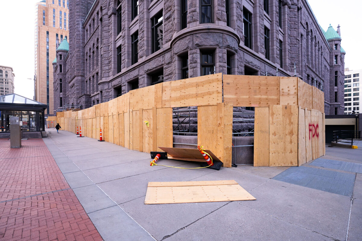 Heavy winds knock off boarding around the Minneapolis City Hall building in downtown Minneapolis.