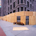 Heavy winds knock off boarding around the Minneapolis City Hall building in downtown Minneapolis.