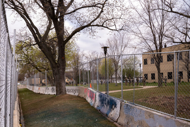 Layers of fencing and military around police station 4 April 15, 2021 - Brooklyn Center, Minn. — Protesters gather for the 5th straight day at the Brooklyn Center Police Department after 20-year old Daunte Wright was shot and killed by a Brooklyn Center Police on April 11th, 2020.