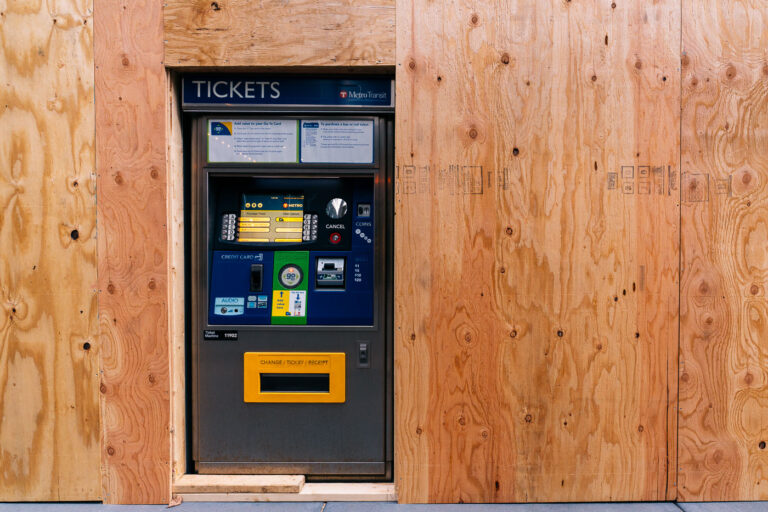 Metro Transit machine with boarded windows 1 A Metro Transit ticket machine on Marquette Ave during the Derek Chauvin murder trial.