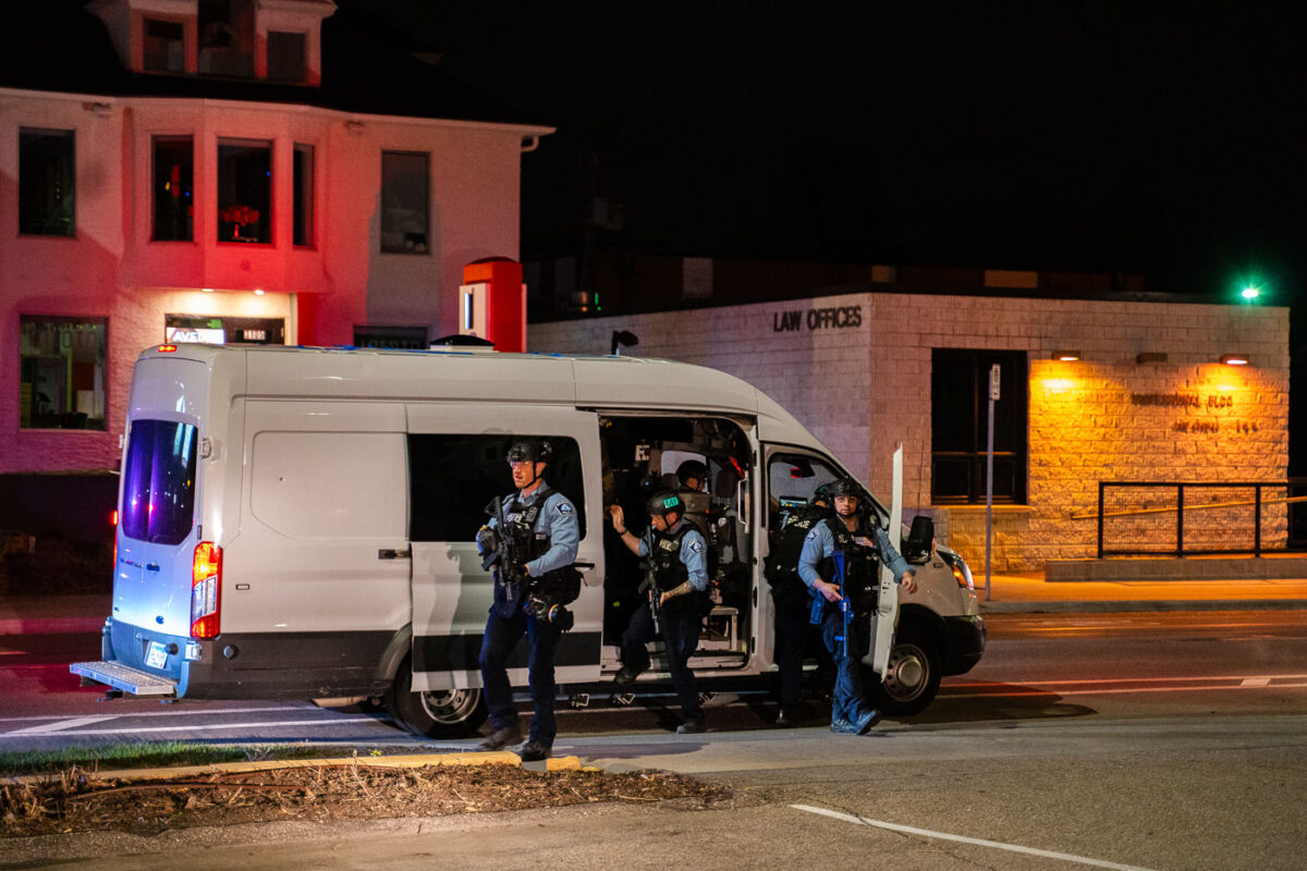 A Minneapolis Police tactical team coming out of a van after reports of looting in Uptown Minneapolis.