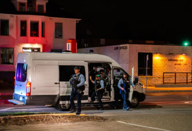 A Minneapolis Police tactical team coming out of a van after reports of looting in Uptown Minneapolis.