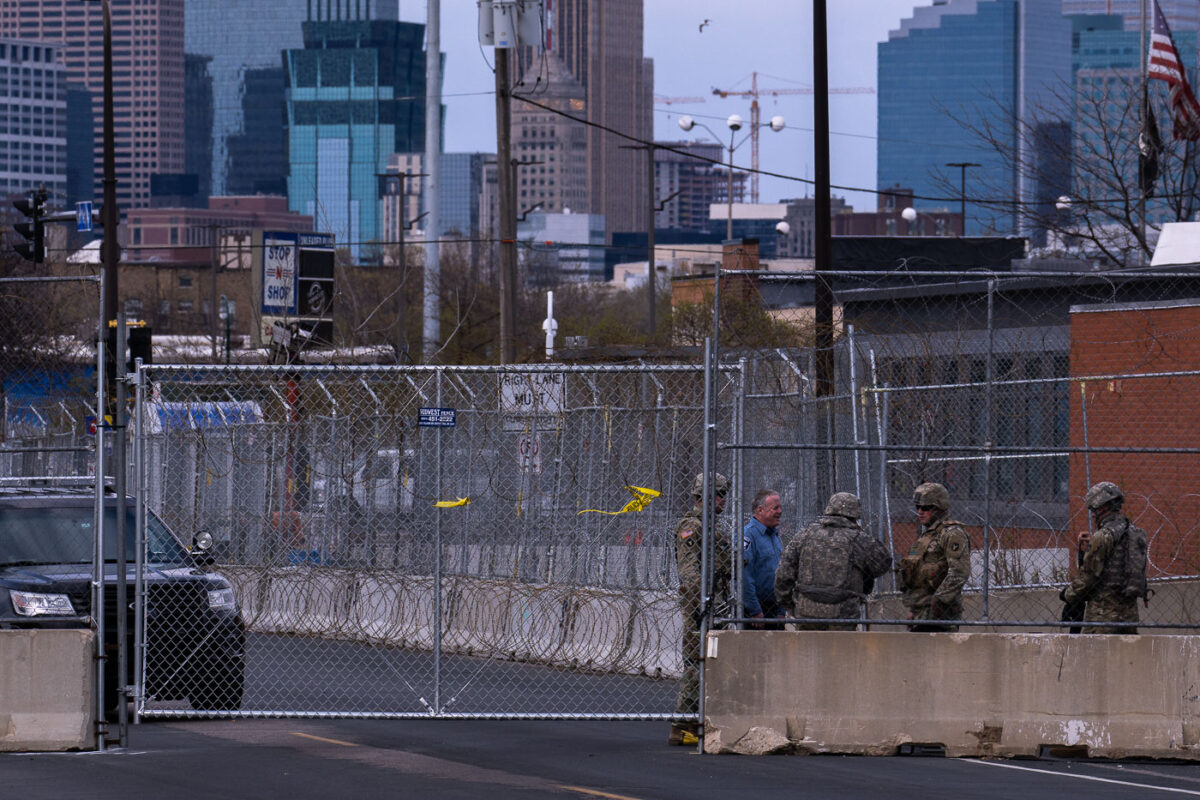 The National Guard stand outside a heavily fortified Minneapolis Police Fifth Precinct.