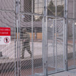 A member of the Minnesota National Guard walks the fencing around the Hennepin County Government Center during the Derek Chauvin murder trial in 2021.