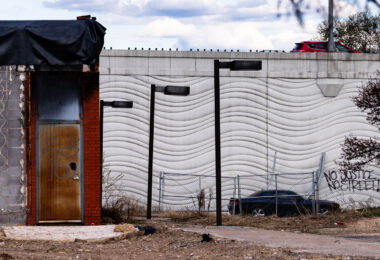 "No Justice, No Street!" written on the side of 35W as seen from a former post office.