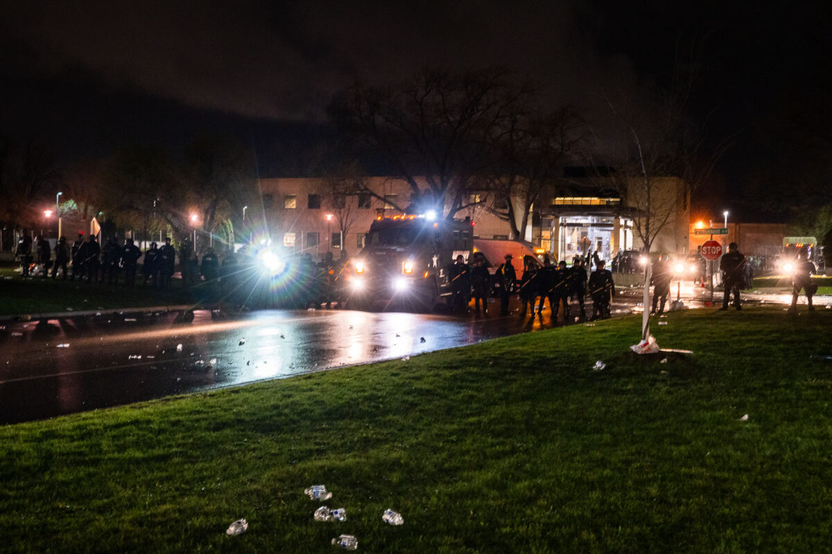 Police push protesters out of the area around the Brooklyn Center Police Department after a day of protest following the April 11th, 2020 shooting death of Daunte Wright by former officer Kim Potter.