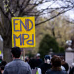 Protesters gather outside the Minnesota Governor's Residence to protest the treatment of protesters over the last week.