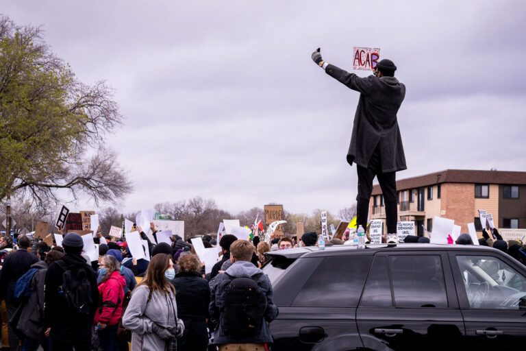 Protester with ACAB sign in Brooklyn Center 1 Protesters outside the Brooklyn Center Police Department after Daunte Wright was killed on April 11th, 2021. Former Brooklyn Center Police Department Kim Potter will stand trial on November 30th, 2021.