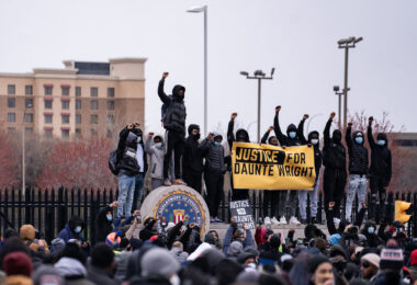 Protesters on top of the FBI Minneapolis Field Office during a march protesting the death of 20-year old Daunte Wright. Wright was shot and killed by Brooklyn Park Police officer Kim Potter during a traffic stop on April 11th.